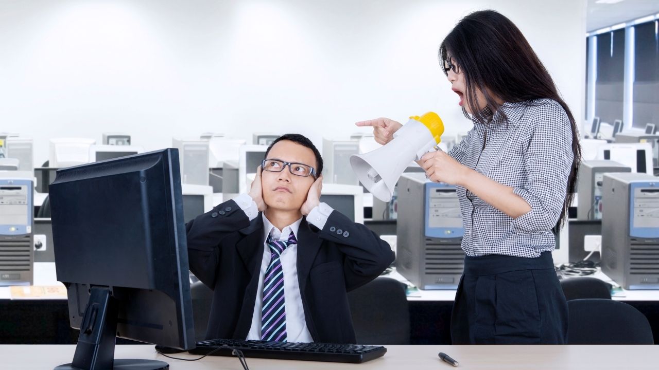 man hands on ears woman megaphone